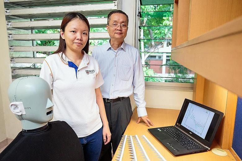 Prof Lee Heow Pueh (far right) and Dr Lee Hsiao Mun and their team worked on the innovative windows. The human dummy helps create a realistic acoustic environment in experiments.