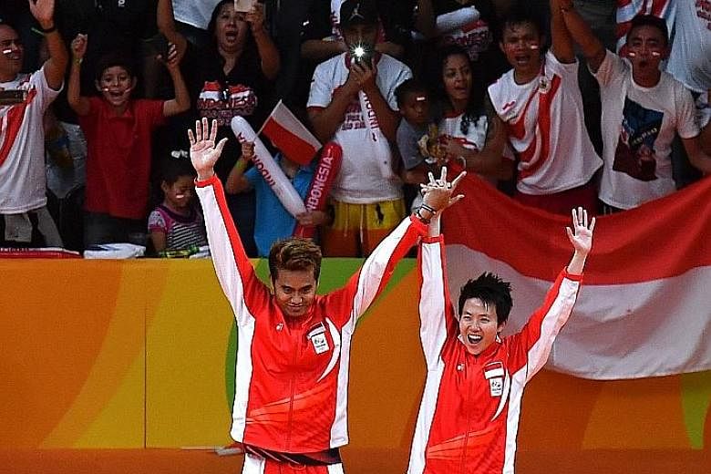 Right: Fans cheering gold medallists Tontowi Ahmad and Liliyana Natsir before they received their gold medals - Indonesia's first in badminton mixed doubles. Left: Malaysia's Goh Liu Ying and Chan Peng Soon were outclassed but not embarrassed in the 