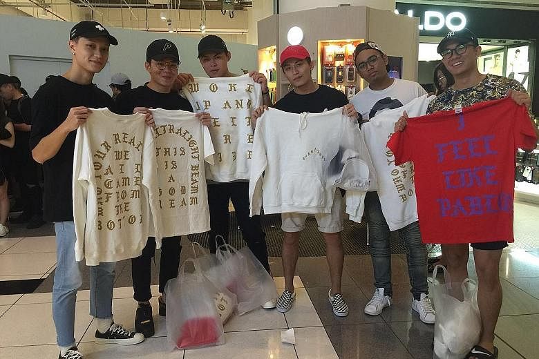 Students (from left) Chia Siu Phong, Kelvin Lim, Oliver Chia, Joshua Chua, Rano Yasne and Richie Ngqueued from 2am yesterday for The Life Of Pablo merchandise.