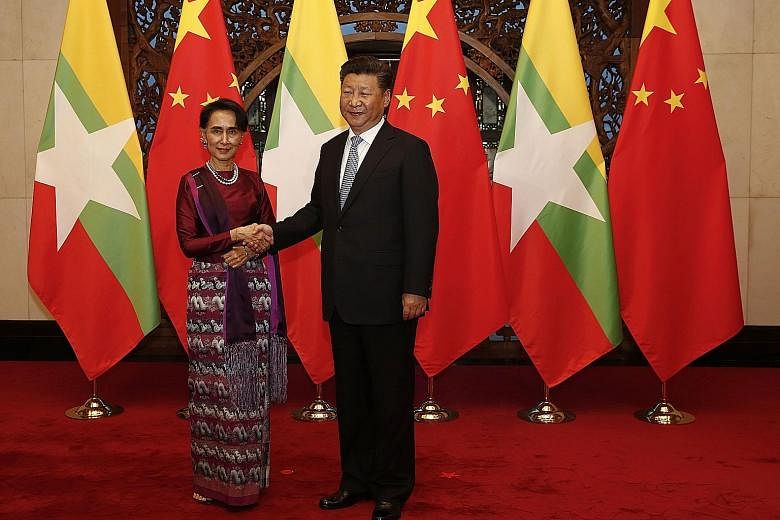Ms Suu Kyi meeting President Xi at the Diaoyutai State Guesthouse in Beijing yesterday. Both leaders pledged to cooperate to maintain peace and stability on their shared border. Analysts say ties are still significant, even after Myanmar's 2010 refor