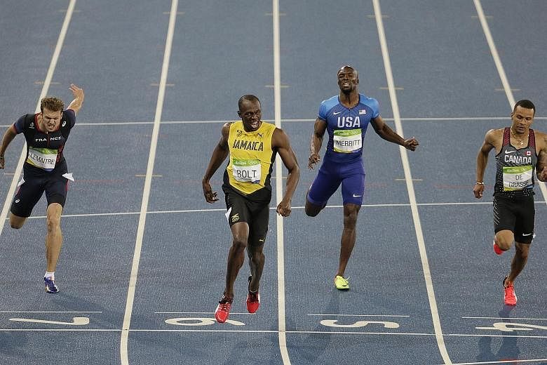 Above: Usain Bolt winning the 200m final in 19.78sec, ahead of Andre de Grasse (right) and Christophe Lemaitre (left). LaShawn Merritt came in sixth. Left: Ever the showman, Bolt will run his final Olympic race this morning in the 4x100m relay.