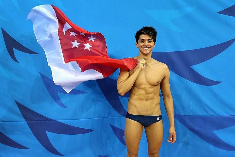 Schooling waving the Singapore flag at the Munhak Park Tae Hwan Aquatics Centre on Sept 26, 2014. He won three medals at the Asian Games, including Singapore's first men's swimming gold medal since 1982. Schooling's natural affinity in the pool was e