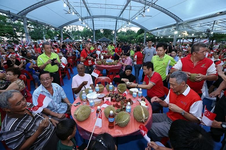 Mr Lee joining residents at the Punggol South Fruits Fiesta. Various races and religions have different food requirements but when it comes to fruits, all barriers come down, he said.