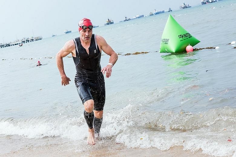 Overall TRI-Factor Series champion Jesper Silkeborg coming ashore after the 750m swim. The Scoot airline captain cites discipline and careful time management and planning as the reasons for his success.