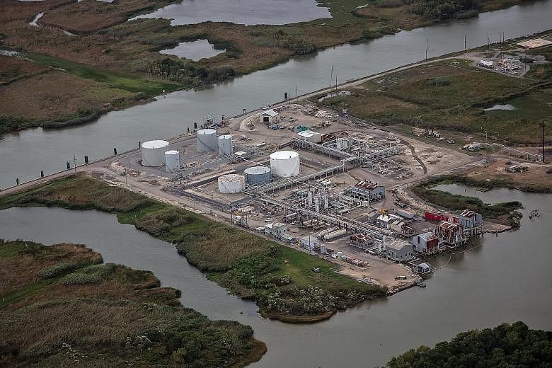 An oil and gas facility in southern Louisiana. Each year, the state loses more than 50 sq km of land to coastal erosion. At Port Fourchon, which services 90 per cent of deepwater oil production, the shoreline recedes by about a metre every month.