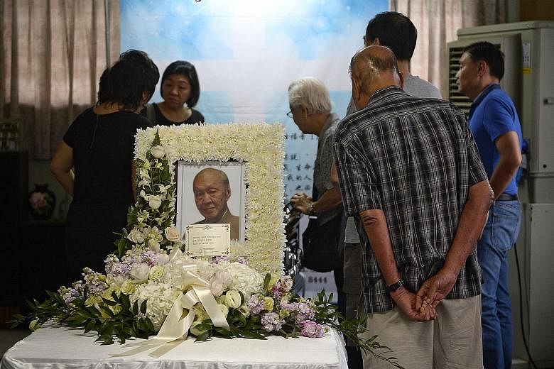 Family friends and relatives at the wake of Mr Chua Kim Yeow at his home yesterday. Mr Chua, who stood against former deputy prime minister Ong Teng Cheong in Singapore's first presidential election in 1993, was also Singapore's first local accountan