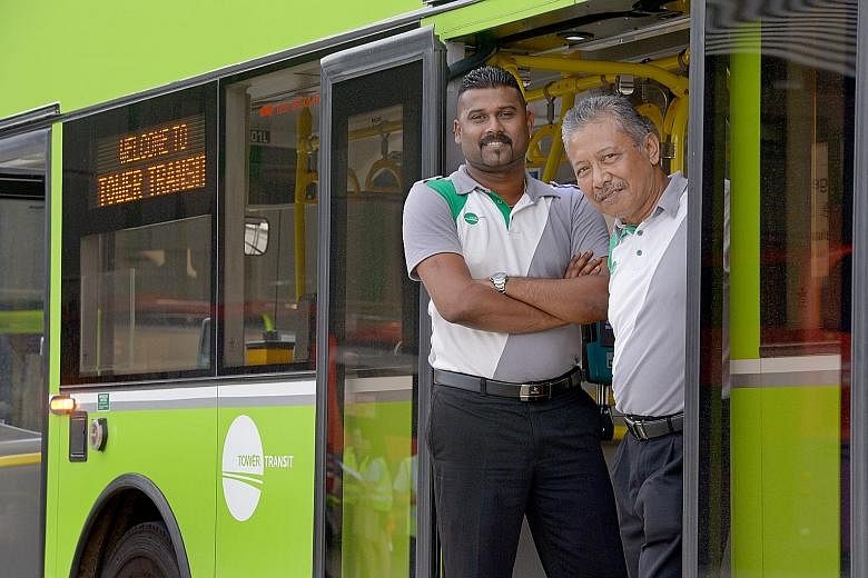 Mr Shanmugam (left), who has 10 years of driving experience, joined Tower Transit as a driver, but has been redeployed to be a trainer. With him is interchange supervisor Abdu Rahi Jusof.