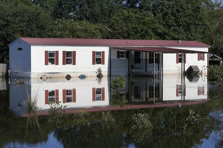 This home in St Amant, Louisiana, in the United States, is one of 40,000 houses damaged by a week of catastrophic floods in the south of the state. So far, 13 people have died and around 30,000 had to be rescued. More than 86,000 have registered for 