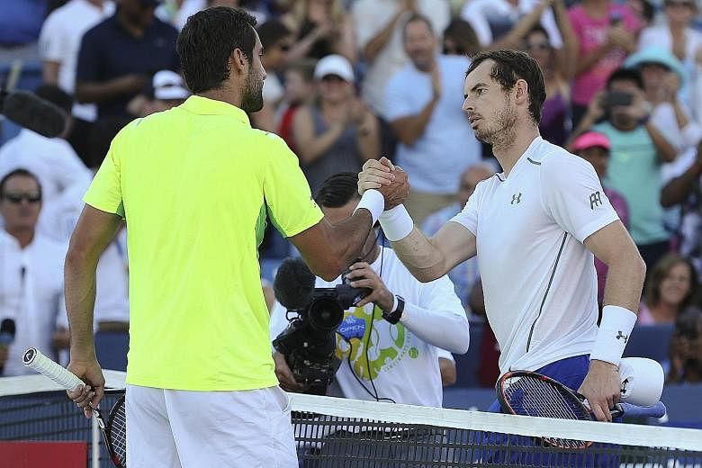 Andy Murray (right) shaking hands with Marin Cilic after the Cincinnati Masters final. The Croatian ended Murray's 22-match winning streak.