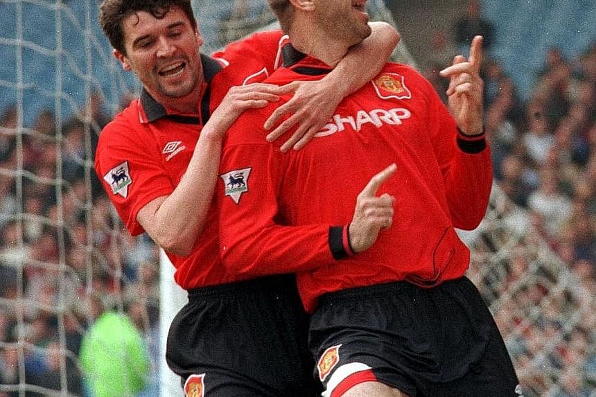 Midfielder Roy Keane (left) and striker Eric Cantona celebrate a goal during Man United's 3-2 win over Man City in the 1995-96 season. The duo were both strong physically and technically, and observers believe Paul Pogba can dominate the midfield lik