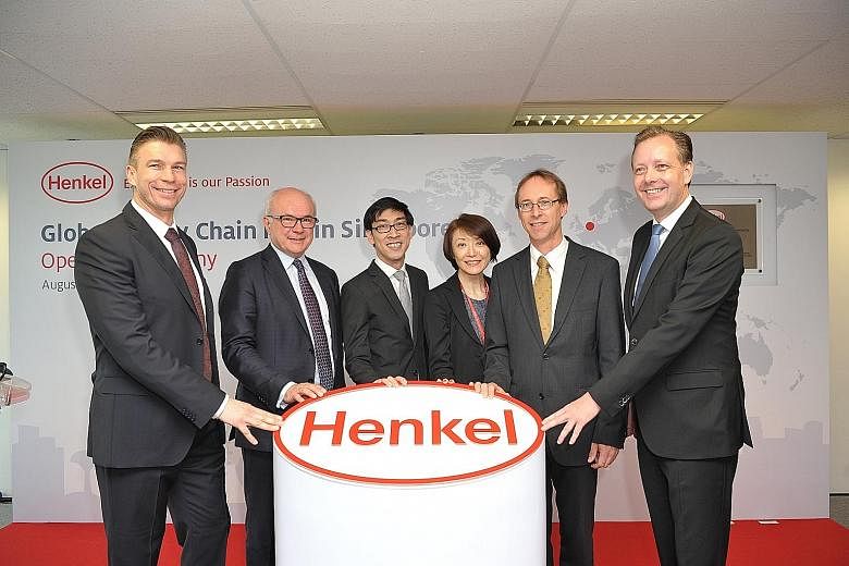 At the opening ceremony of Henkel's global supply chain hub in Singapore yesterday were (from left) Mr Rolf Knoerzer, Henkel vice-president operations & supply chain asia pacific; Mr Bertrand Conqueret, Henkel president global supply chain; Mr Chan I