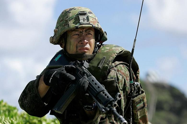 A soldier with the Japan Maritime Self-Defence Force at a simulated assault in Hawaii last month.