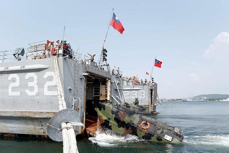 A handout photo showing an Amphibious Armoured Personnel Carrier being loaded onto a warship in the Han Kuang 32 military drill. The five-day annual exercise began on Monday.