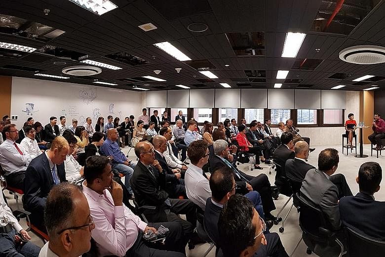 MAS managing director Ravi Menon speaking to an audience at the launch of Looking Glass @ MAS. The facility, which is in the MAS building, will allow financial institutions and start-ups to experiment with fintech and facilitate consultations between