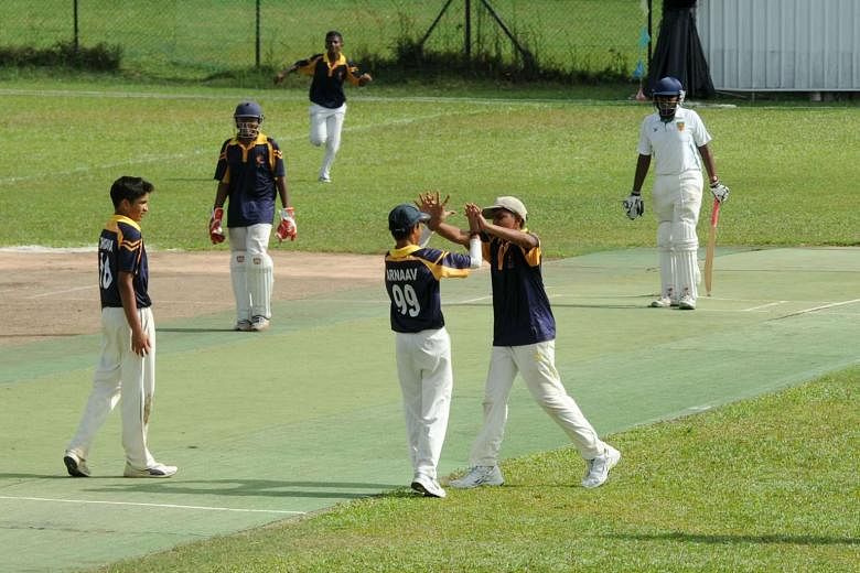 ACS(I) players celebrate the dismissal of RI's Aryan Badhe, who was caught at point while trying to force the pace. Off-spinner Arnaav Chabria took 3-14 to help seal the win. 
