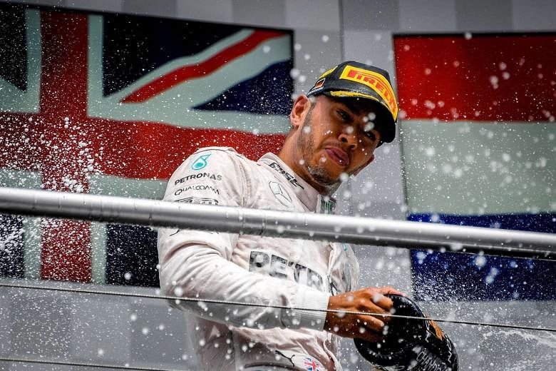 Mercedes driver Lewis Hamilton celebrates after emerging victorious at the German Grand Prix last month. As F1 returns from a break, the Briton is aiming to return to winning ways. He has won the last four races. 