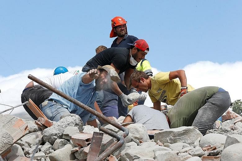 Rescuers and residents combing through Amatrice for survivors buried under the collapsed buildings on Wednesday. Rescuers digging through the rubble in search of life in Amatrice on Wednesday after a shallow quake destroyed the town, which was to hos