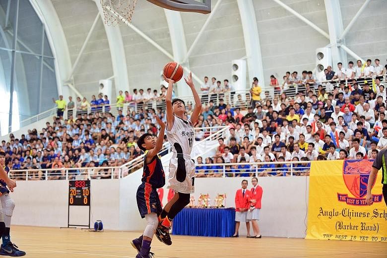 Presbyterian High School's Foo Yong Ming shooting during yesterday's 78-43 victory against Anglo-Chinese School (Barker Road) in the Schools National C Division final.