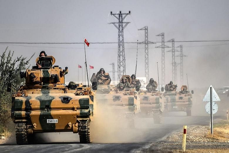 Turkish army tanks heading towards the Syrian border town of Jarabulus. Syrian rebels, backed by the US and Turkey, declared on Wednesday evening that they had seized the town of Jarabulus and its surroundings, which had been ISIS' last major redoubt