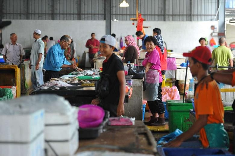 Malaysians of different races mingle in Pasar Awam in Batu Pahat, Johor. Malaysia needs to find the right formula to unite the country without suppressing its diversity, and doing it while achieving real and concrete economic growth. 