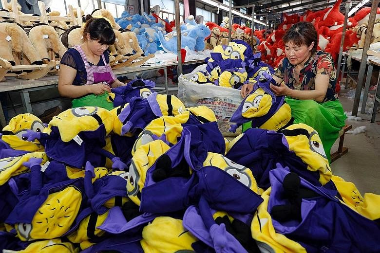 Workers making soft toys at a factory in China's Jiangsu province. As the size of Asean's middle class is expected to more than double by 2025 to include 125 million households, its new consumers will buy not only brands from the West and Japan, but 