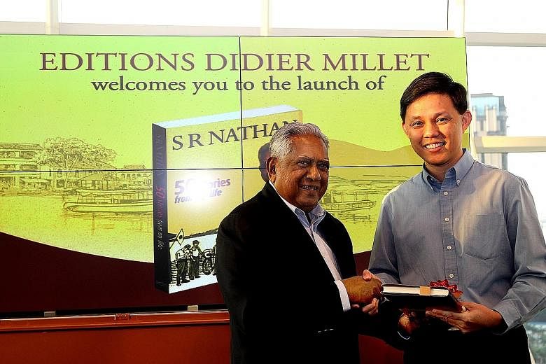 Mr Nathan presenting his book, 50 Stories From My Life, to Mr Chan at its launch in 2013. Mr Chan was the guest of honour at the event.