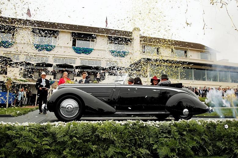 Among the vehicles on display were a 1959 Ferrari SpA 250 GT LWB California Spider (above) and a 1932 Bugatti Type 55 Roadster (left). The 1936 Lancia Astura Pinin Farina Cabriolet had bodywork by Italian design powerhouse Pininfarina and had once b