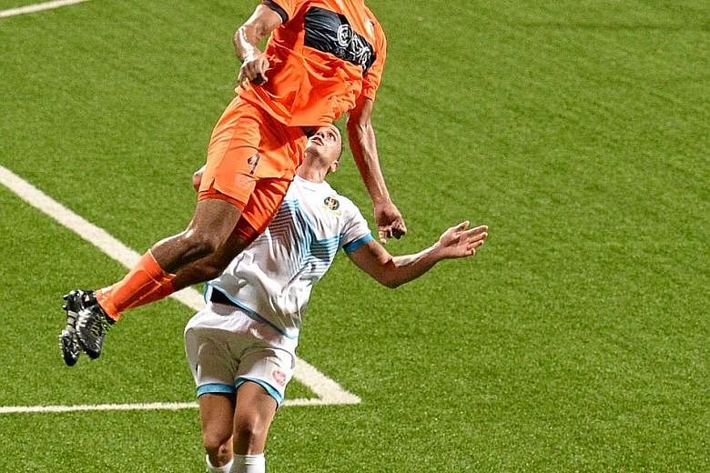 Hougang United's Delwinder Singh rising high to head the ball during his team's 1-2 S-League loss to Brunei DPMM at the Jalan Besar Stadium last night.