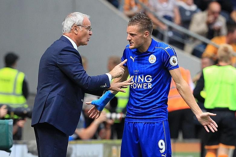 Leicester manager Claudio Ranieri passing instructions to striker Jamie Vardy in their season opener against Hull. Vardy has yet to find the net this season, but Ranieri is confident he can eventually work well with new strike partner Ahmed Musa.