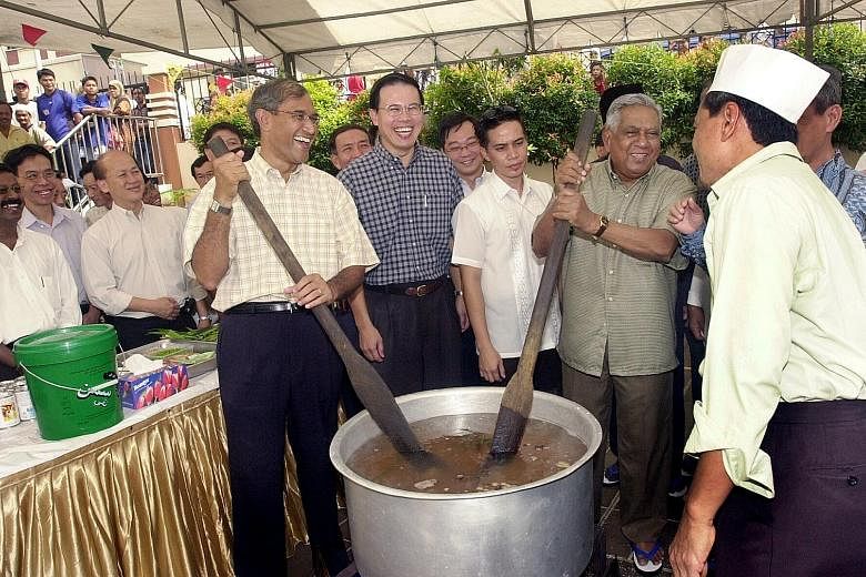 Mr Nathan with Mr Zainul and MP Teo Ho Pin at a President's Challenge charity briyani event at Al-Iman Mosque in 2004.