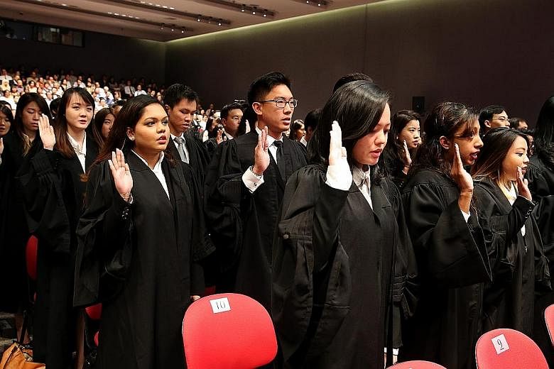 The new batch of freshly-minted lawyers taking their oath yesterday. Over three sessions at the Supreme Court auditorium, a total of 509 lawyers were called to the Bar.