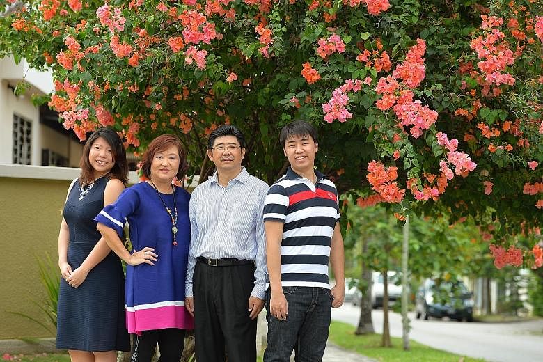 Ms Susan Tong (second from left) and her husband David Koh (third from left), a 57-year-old retiree, outside their corner terrace house in Yio Chu Kang, with the second of their three sons, Lionel (extreme right), 28, a strategy analyst, and his wife