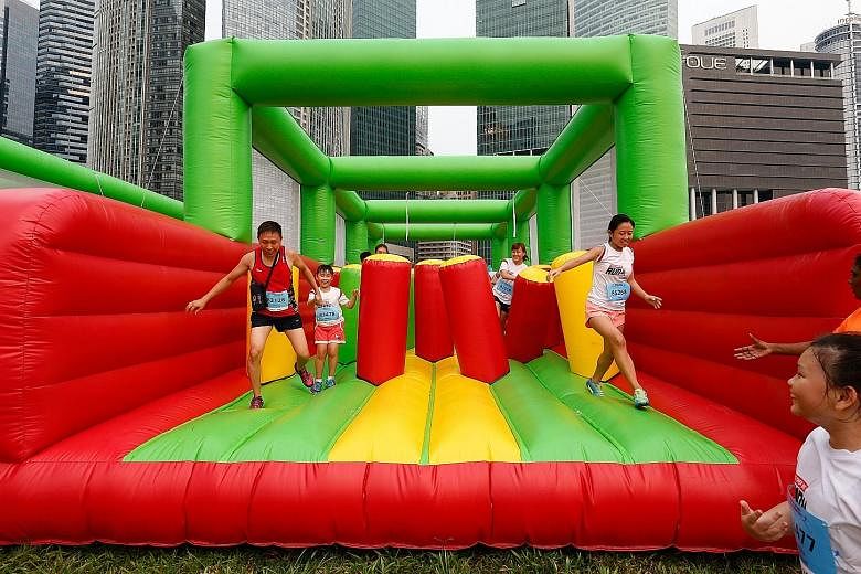 The giant inflatables in the 5km fun run were a hit with participants, and lines of between five to 10 people formed before each obstacle.