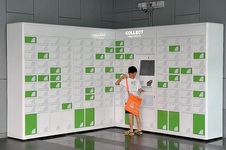 At self-service lockers, like this one at Jurong Regional Library, users can pay the reservation fee and collect the reserved item.