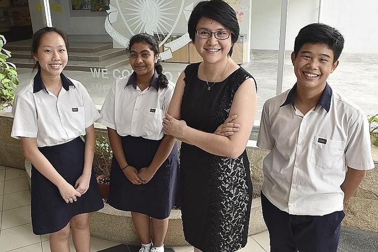 Geylang Methodist Secondary School senior mathematics teacher Wendy Wong with students (from left) Ng Shu Wei, Raziya Begum and Ulysse Yeo, all 15. Changing students' mindsets is no easy task, but Ms Wong says she does not give up easily.
