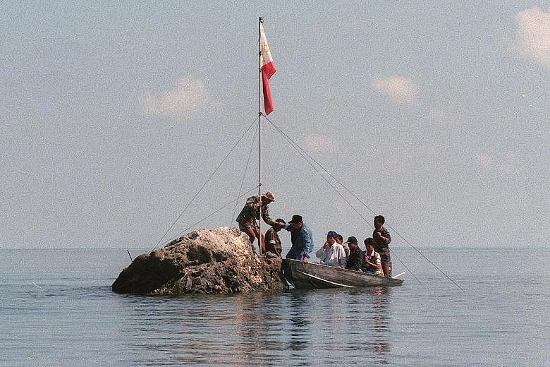 A Philippine team on Scarborough Shoal on May 17, 1997.