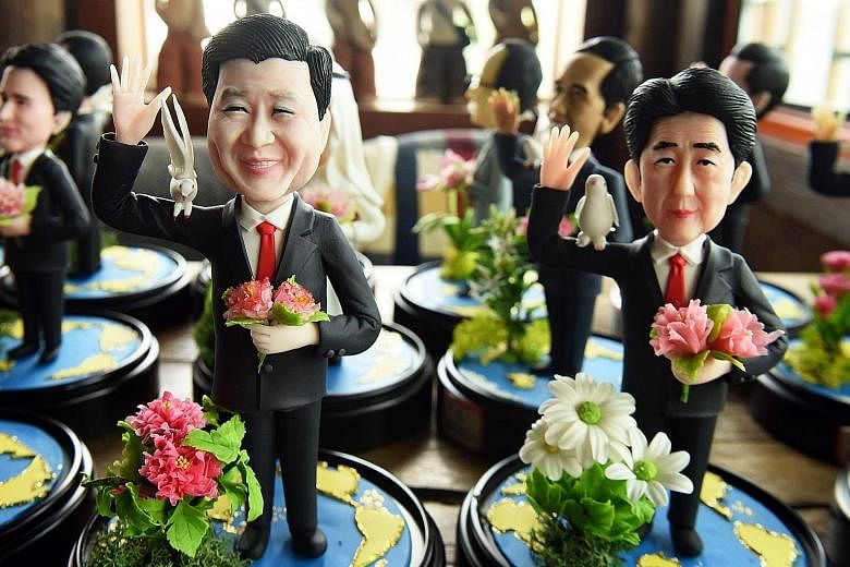 Dough figurines of G-20 leaders, including Chinese President Xi Jinping (forefront, left) and Japanese Prime Minister Shinzo Abe, made by craftsman Wu Xiaoli for the upcoming summit in Hangzhou, Zhejiang province. The 11th G-20 Leaders Summit will be