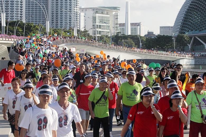 More than 5,000 people took part in a 21/2km community parade cum brisk walk at Marina Bay last year. Walking is the most popular physical activity among Singaporeans.