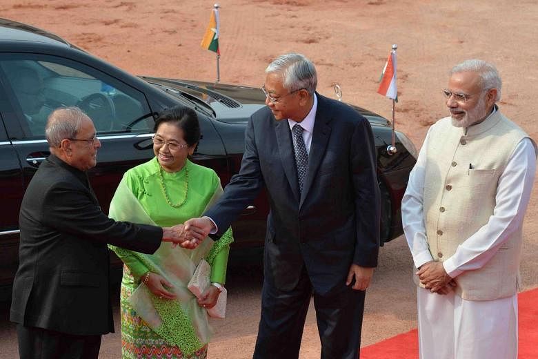 Myanmar's President U Htin Kyaw (second from right) and his wife Su Su Lwin are greeted by Indian President Pranab Mukherjee (far left) in India yesterday. With them is Indian Prime Minister Narendra Modi. 