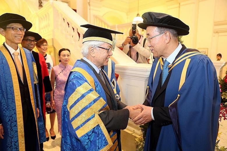 President Tan with Mr Ban at yesterday's ceremony at the Istana, where the UN chief received an honorary Doctor of Letters degree from NUS. Dr Tan is also the NUS chancellor.