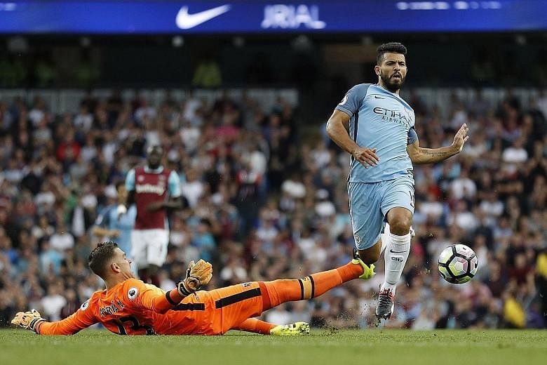 Sergio Aguero in action with West Ham goalkeeper Adrian in Manchester City's 3-1 Premier League win on Sunday. The striker suffered a calf injury towards the end of the match.