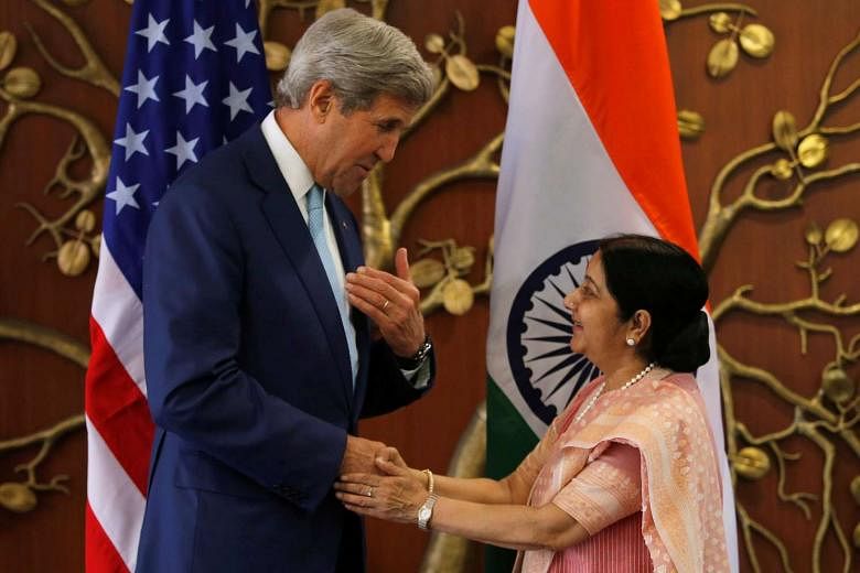 United States Secretary of State John Kerry with Indian Foreign Minister Sushma Swaraj before the start of the second India-US Strategic and Commercial Dialogue yesterday in New Delhi. 