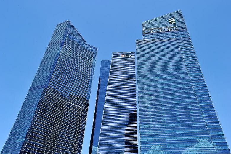 Marina Bay Financial Centre. Business loans fell 5 per cent year on year in July to reach $351.8 billion, the 11th straight month of decline, according to preliminary data released by the Monetary Authority of Singapore yesterday.