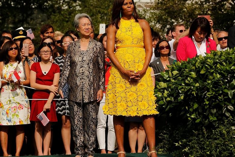 Naeem Khan's yellow dress worn by United States First Lady Michelle Obama (left, seen with Mrs Lee Hsien Loong) and looks from the designer's Resort 2017 collection (above).