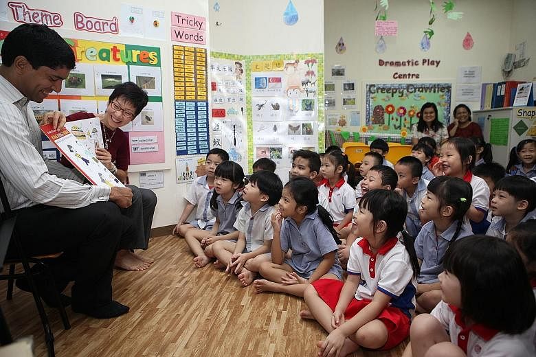 Ms Fu and Mr Vikram Nair, MP for Sembawang GRC, reading the book to pre-schoolers at PCF Sparkletots Admiralty Childcare. The book, written by Touch Community Services, will be distributed to 50,000 pre-schoolers.