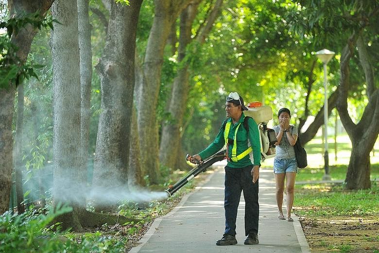 Misting being carried out yesterday near Block 101, Aljunied Crescent. Those living in the Zika cluster say they are not overly worried and take the necessary precautions.