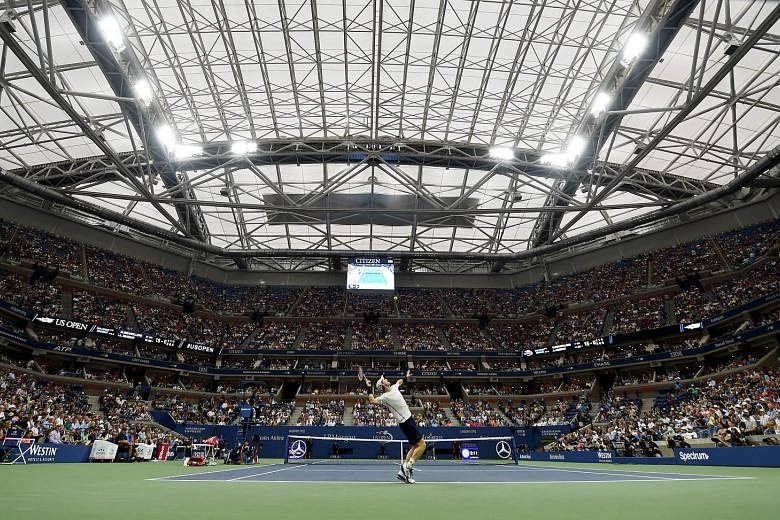 Second seed Andy Murray during his 6-4, 6-1, 6-4 win against Marcel Granollers under the new roof at Arthur Ashe Stadium on Thursday. The Briton felt that the noise of torrential rain on the closed roof made it difficult to hear the ball, but Rafael 