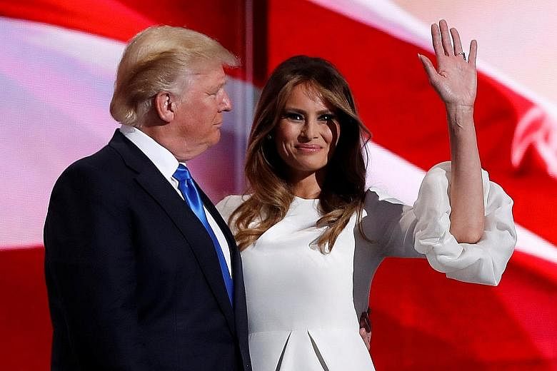 Mrs Trump with her husband at the Republican National Convention in July. She is suing Mail Media, publisher of Daily Mail Online, and Mr Webster Tarpley, who publishes a blog.