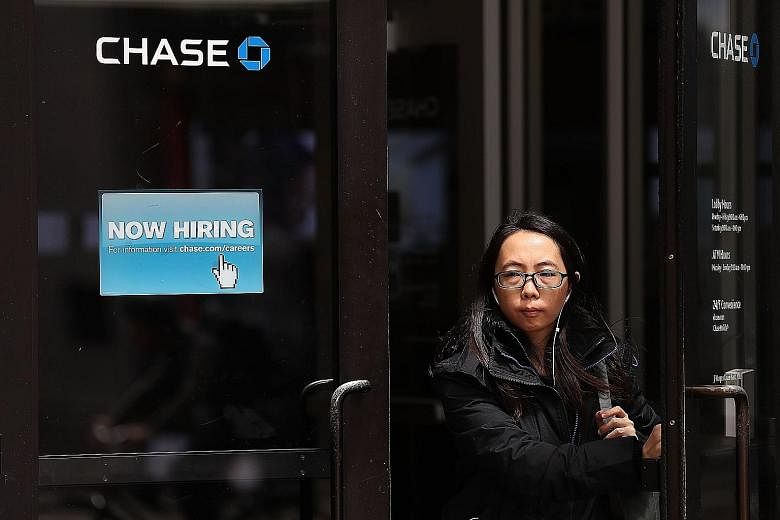 A recruitment sign outside a bank office in San Francisco, California. Despite robust US jobs numbers, the subdued inflation outlook and weakness in manufacturing and mining employment suggest that the Federal Reserve is likely to stay cautious in it