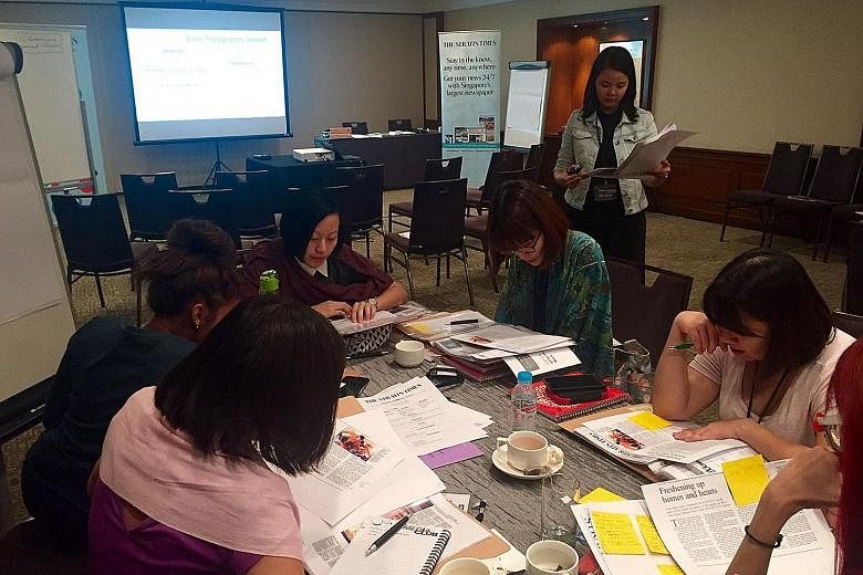 Educators taking part in a group activity during a feature writing workshop. Held on Aug 30 and 31, it was jointly developed by The Straits Times Schools department and specialists from English- language learning space Between the Lines.